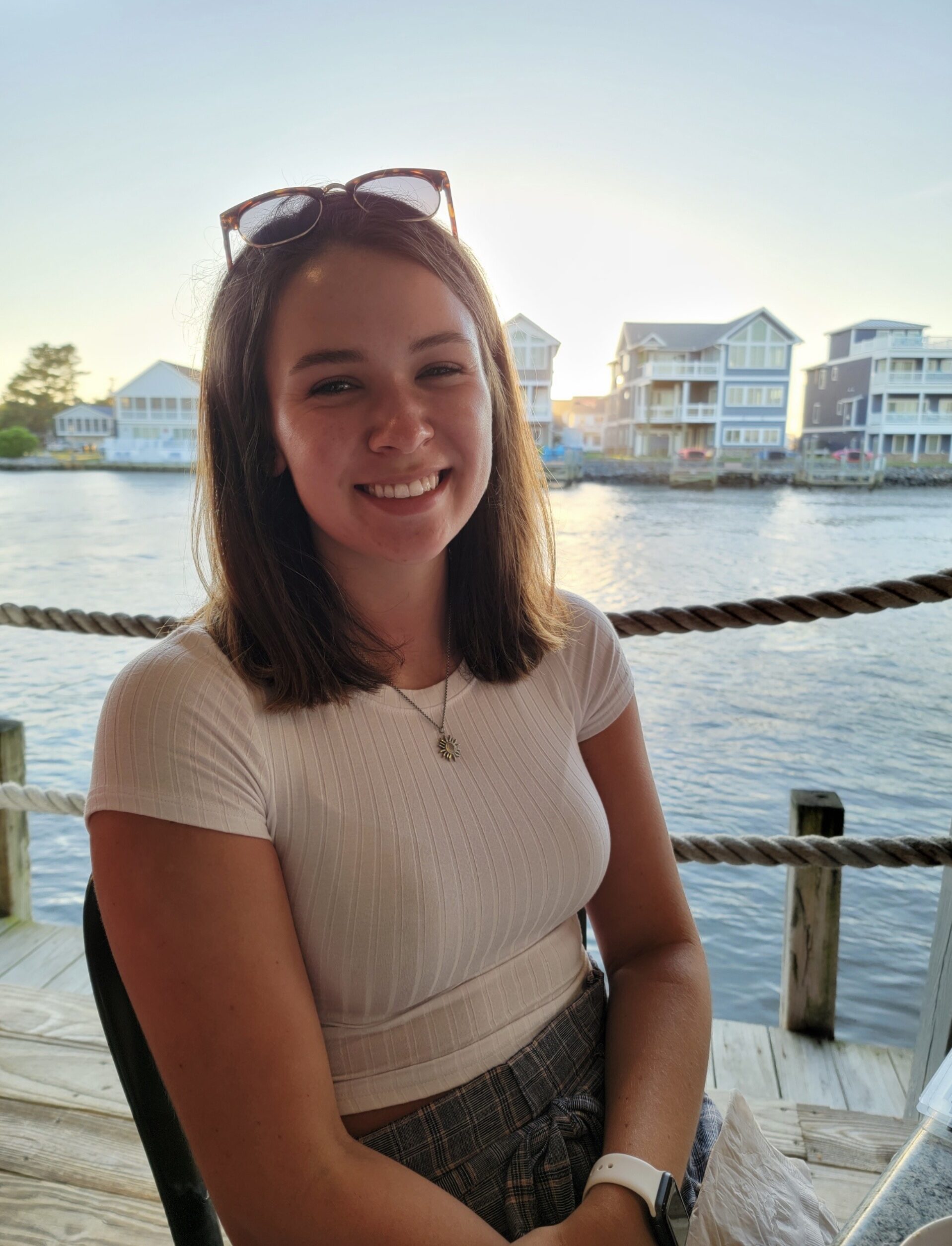 girl smiling in front of the bay